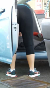Girl in tight see through leggings with nice ass cleaning her car