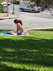 Suntanning Season is back! Black Thong Girl Tanning!