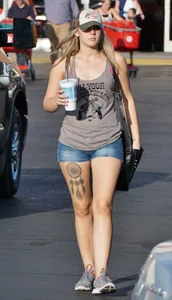 Hot blonde after shopping in short jean shorts and tank top