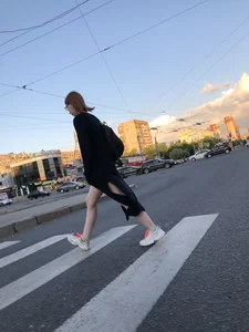 Teen wearing black dress which becomes transparent