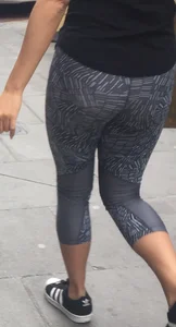 Sexy girl walking in grey patterned leggings with friend in tight jeans