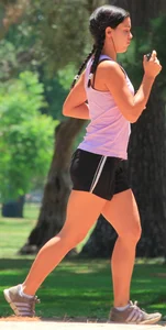 Hot brunette running in short shorts with vpl