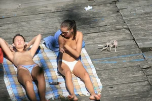 Two teens stripping and going topless to tan