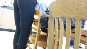 Girl with Fit Legs in Yoga Pants Bending Over