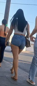 super sexy denim short shorts on this brunette with tremendous legs and big butt