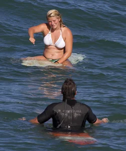 Candid surfer babes on the beach and in bikinis