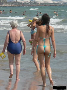 Bunch of sexy babes at the beach in thong bikinis
