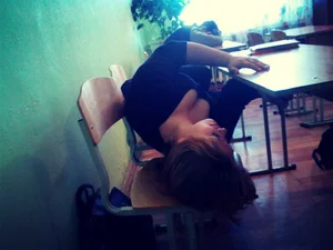College Teen Girl Lying on Two Chairs in Classroom Downblouse Sideboob Photo
