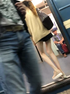Very Skinny Girl Wearing Glasses with Long Legs in a Short Skirt Falling Asleep in a Subway Train Candid