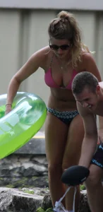 Blonde bikini girl at the pool in pink bikini top with amazing tits