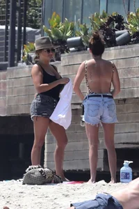 Ashley Tisdale in cheetah print swimsuit on the beach in Malibu