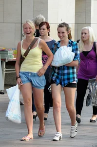 Pretty blonde and brunette friend walking in shorts