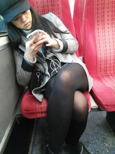 Asian babe on the bus in skirt and stockings