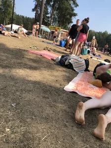 Pale Girl in Swimsuit Lying on a Lake Beach With Her Friends Creepshots Gallery