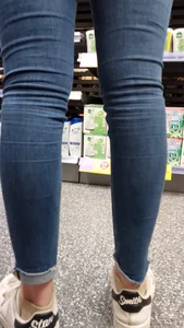 Brunette girl with nice ass sexy PAWG in tight jeans in a store