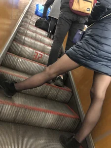 Tall Girl With Awesome Long Legs in Black Pantyhose Asleep in the Subway Train With Crossed Legs, Then Standing on the Escalator With Widely Spread Legs Hot Creepshots Gallery