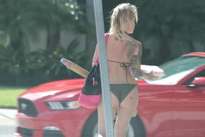 Sexy alt bikini babe with a nice body and tattoos