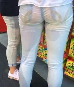 Girl in wet jeans making them semi see through