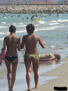 Bunch of sexy babes at the beach in thong bikinis