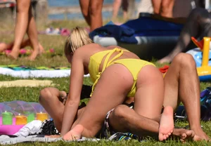 Blonde looking sexy in a yellow bikin