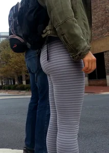 College girl in striped leggings walking with nice ass