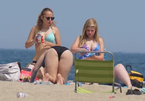 3 girls on the beach in bikinis with big boobs, one brunette and two blondes