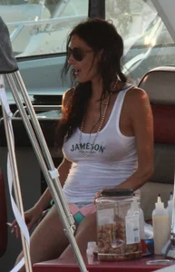 Bikini babe on a boat with a wet see through white shirt showing her tits