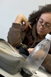 Tall curlyhead college girl in skin coloured leggings