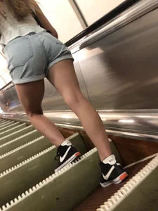 Subway escalator creepshots of a candid girl in shorts