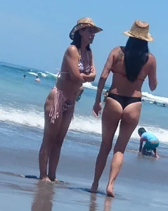 2 milfs in thong bikinis on the beach
