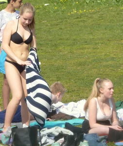 Teen taking off her dress in the park