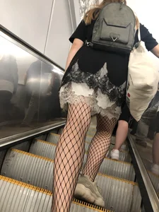 Cute Girl in Lacey Semi-Transparent Dress and Fishnet Pantyhose Subway Escalator Candid Photos Gallery