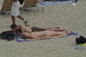 Topless girls on a beach in Barcelona
