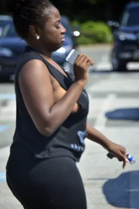 Chubby black lady with big tits and no bra lets it slip