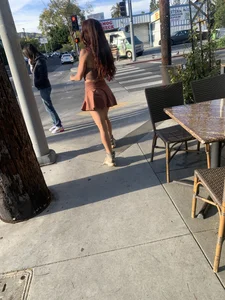 Street candid girl with hot legs in a short dress