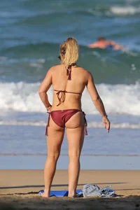 Hilary Duff in maroon bikini on the beach with a big booty
