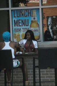 Sexy ebony Tilted Kilt employee in her uniform