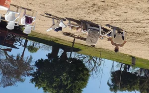 Blonde beach girl with a great ass in pink thong bikini