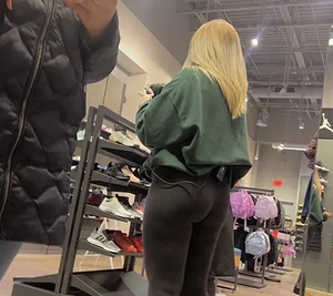 Blonde Finish line store worker in black leggings
