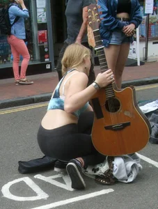 Guitar playing blonde babe with a nice ass and vtl in tight leggings