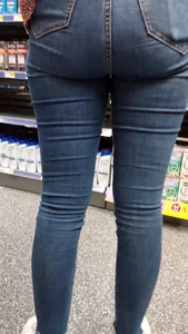 Brunette girl with nice ass sexy PAWG in tight jeans in a store