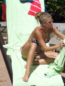 Blonde babe at the pool with sexy body in USA bikini