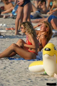 Beach voyeur girls in bikinis, thongs and topless