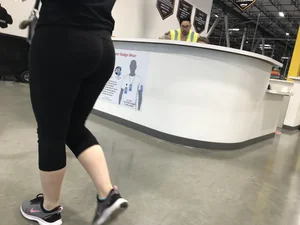 Sexy Amazon employee in leggings with a nice ass