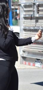 Thick brunette with a big booty in tight black leggings