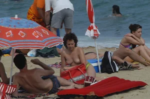 Topless girls on a beach in Barcelona