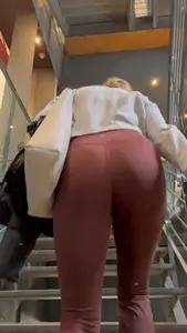 Pt.2 blonde with a nice ass going up the stairs in maroon flared leggings