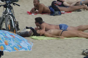 Topless girls on a beach in Barcelona