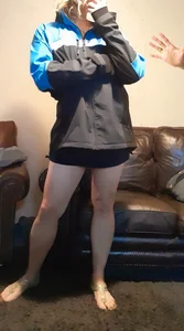 Blonde date with great legs in black miniskirt dressed as delivery girl at Halloween party