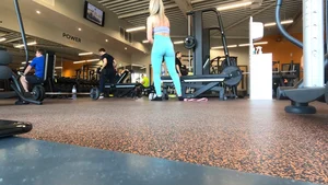 Gym blonde in turquoise leggings notices me and doesn’t mind, even moves in front of me later for some close-ups